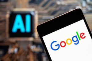 Google logo seen displayed on a smartphone with an Artificial intelligence (AI) chip and symbol in the background.