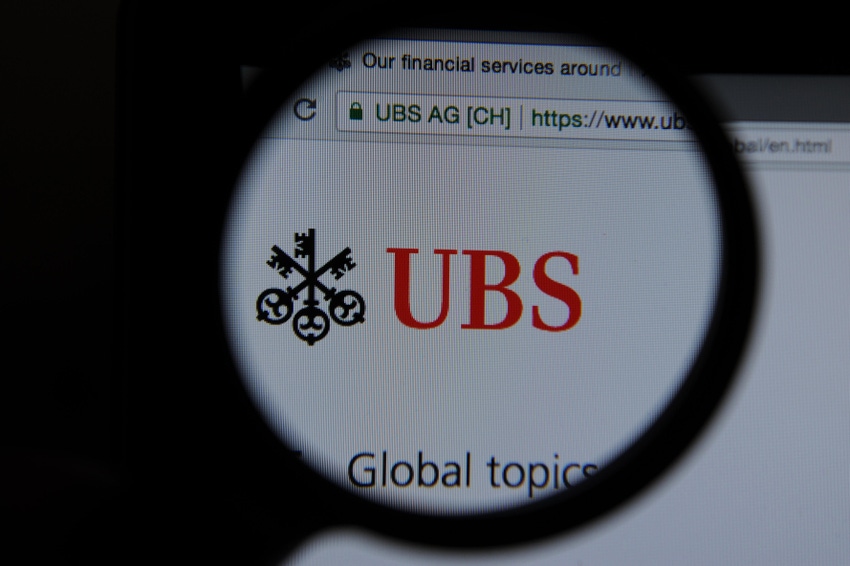 UBS website seen through a magnifying glass.