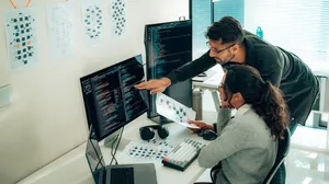 Two developers at computers Two developers at computers
