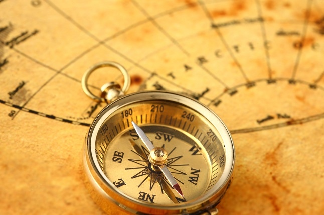 Antique golden compass and old map Antique golden compass and old map
