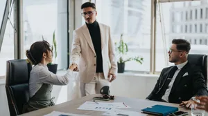 Business people engaged in a productive office meeting Business people engaged in a productive office meeting