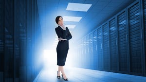 Businesswoman standing in data center.