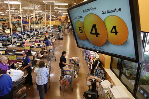 Kroger's QueVision system includes a display that keeps customers and store staff informed about how checkout lines are moving.