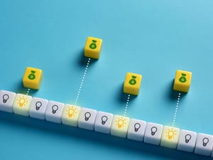 dice with lightbulbs and moneybags dice with lightbulbs and moneybags