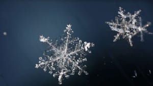 two snowflakes in blue background