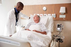 Doctor attending to a patient in a hospital room