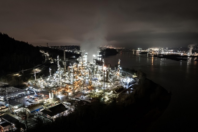 Oil refinery aerial view at night, hyper lapse, distillation tower, gas production, smoke stack, near Vancouver, Canada