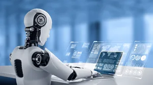 A robot looks at illustrations of data. A robot looks at illustrations of data.