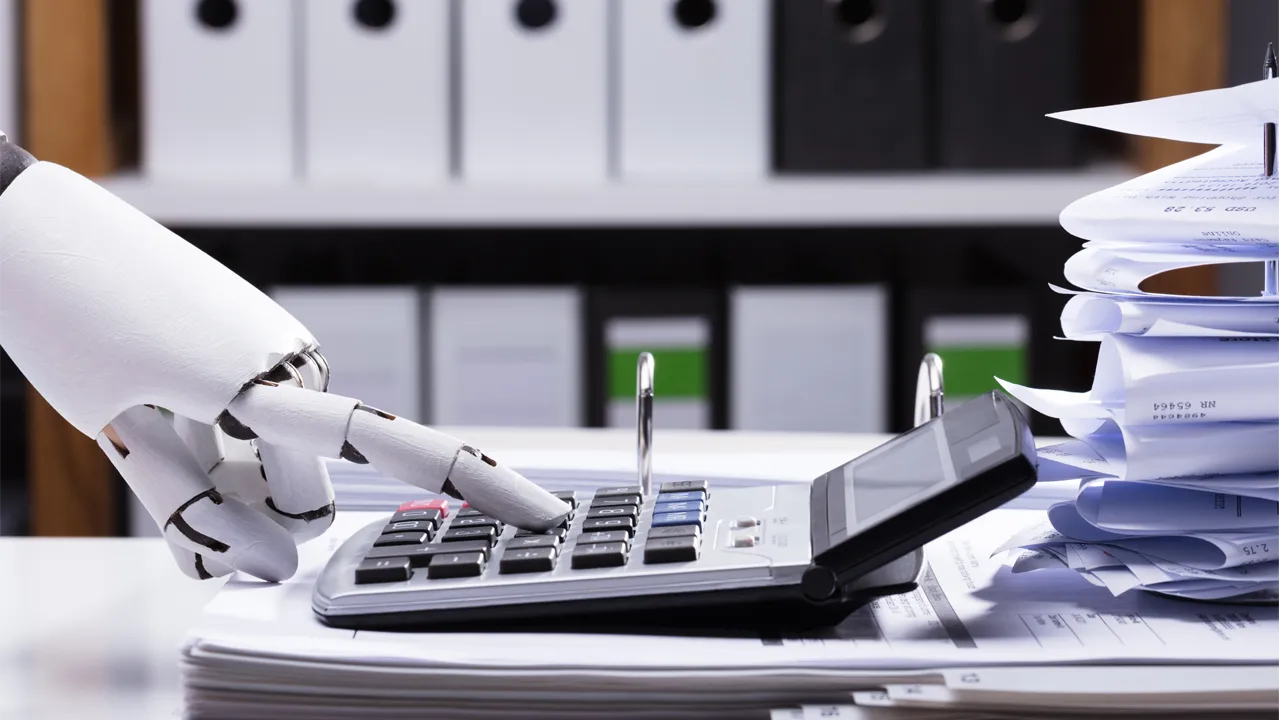 A robot finger uses a calculator A robot finger uses a calculator