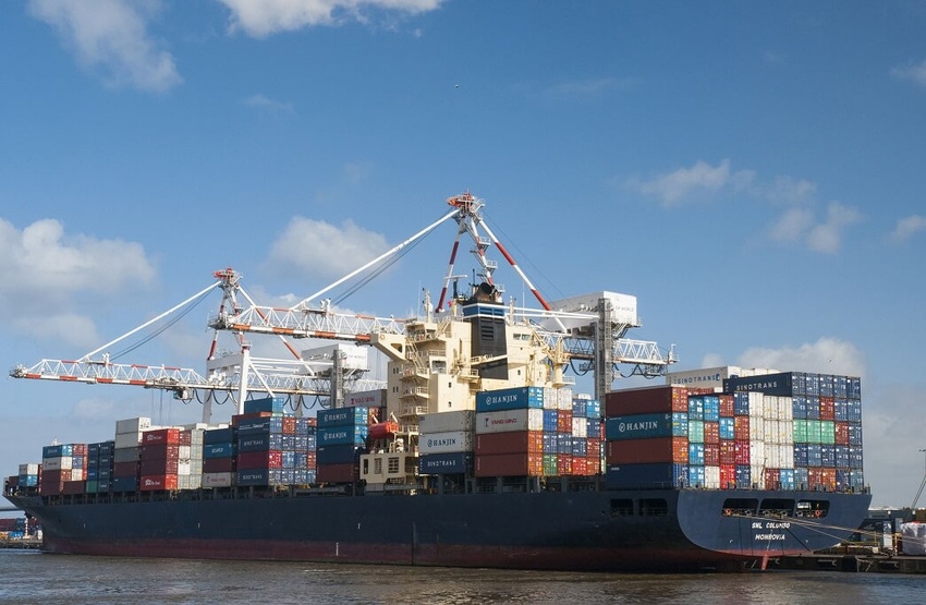 Cranes and gantries load and unload container ships in the Port of Melbourne, Australia