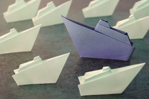 Origami paper ships, change business concept