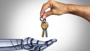 A human hand gives a set of keys to a robot hand A human hand gives a set of keys to a robot hand