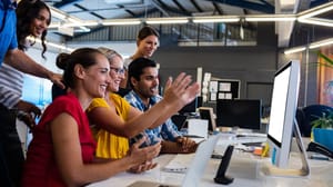 Business team working on a computer Business team working on a computer