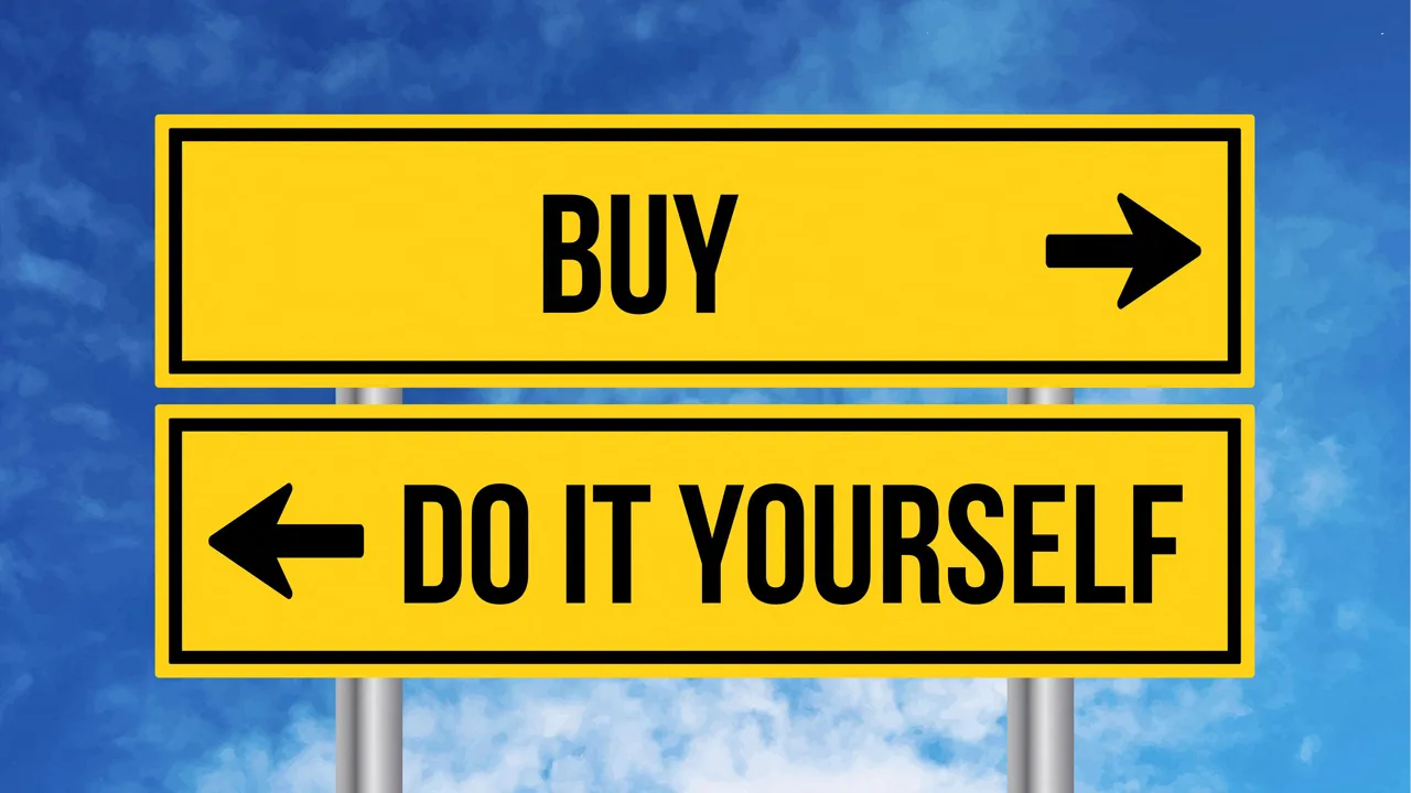 A buy sign sits above a do-it-yourself road sign, against a blue sky background A buy sign sits above a do-it-yourself road sign, against a blue sky background