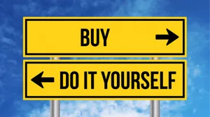 A buy sign sits above a do-it-yourself road sign, against a blue sky background A buy sign sits above a do-it-yourself road sign, against a blue sky background