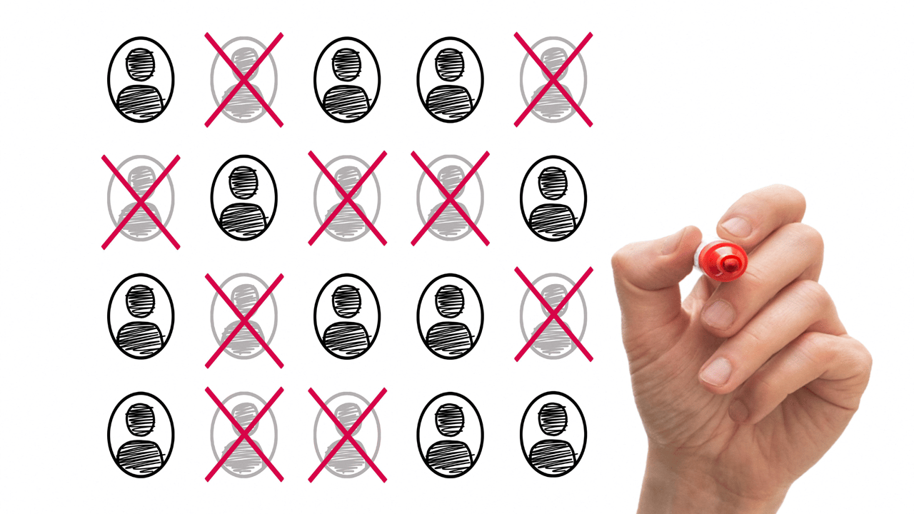 A hand holds a red pen to an org chart with silhouettes crossed off. A hand holds a red pen to an org chart with silhouettes crossed off.