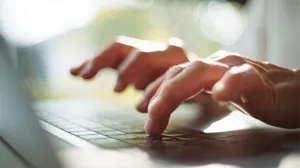 Two hands at a keyboard Two hands at a keyboard