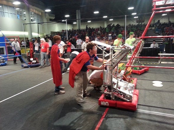 Competitors in the FIRST Robotics Competition get their machines ready to rumble at the Greater Ft. Lauderdale Convention Center