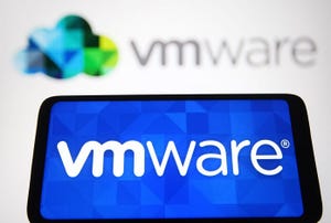 VMware Inc. logo of a cloud computing and virtualization technology company is seen on a smartphone and in the background.