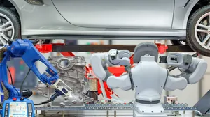 Robotic arms work on a car in a factory, an example of industrial AI Robotic arms work on a car in a factory, an example of industrial AI