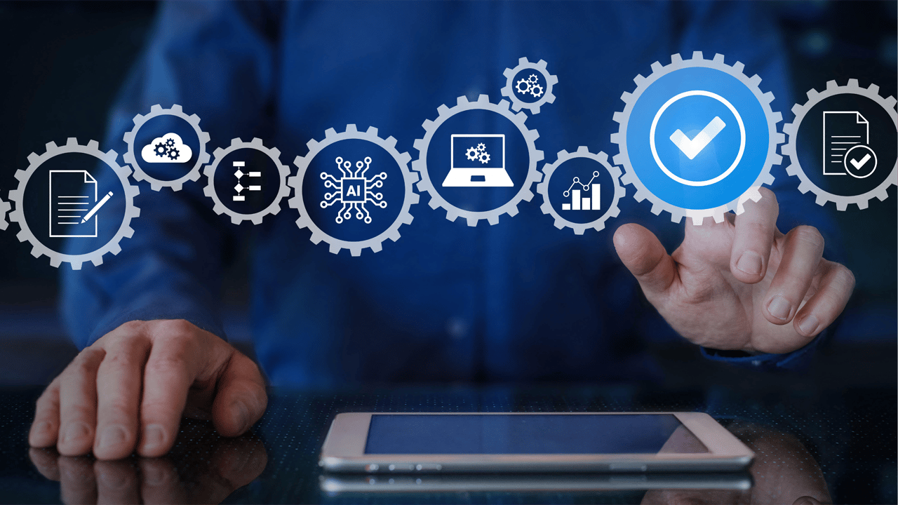 An IT executive touches a checkmark on an overlay of a business workflow. An IT executive touches a checkmark on an overlay of a business workflow.