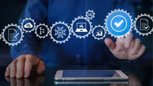 An IT executive touches a checkmark on an overlay of a business workflow. An IT executive touches a checkmark on an overlay of a business workflow.