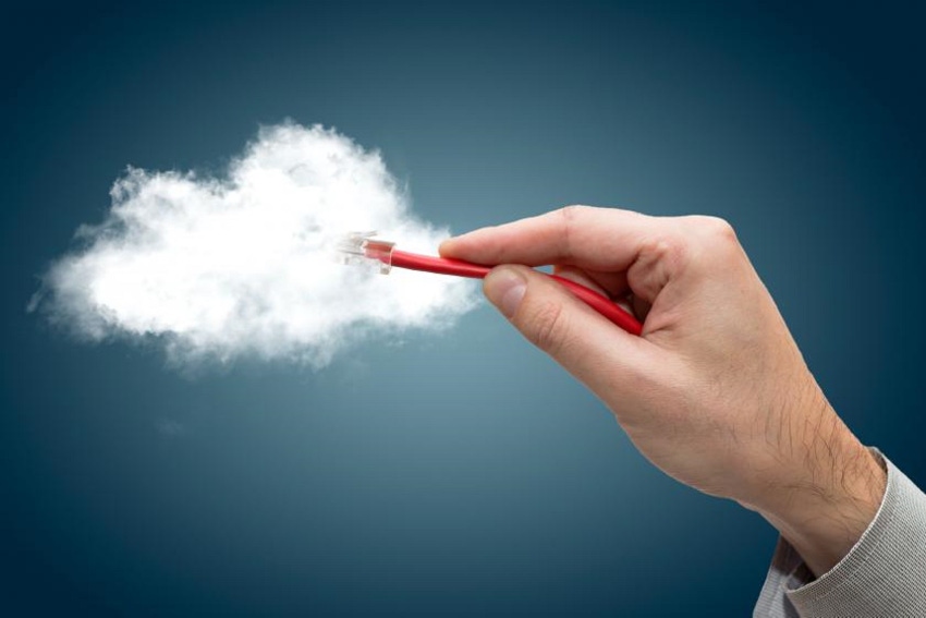 hand plugging a cord into a cloud