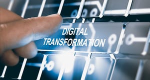 Finger pressing a digital button with the text digital transformation. Concept of digitalization of business processes.