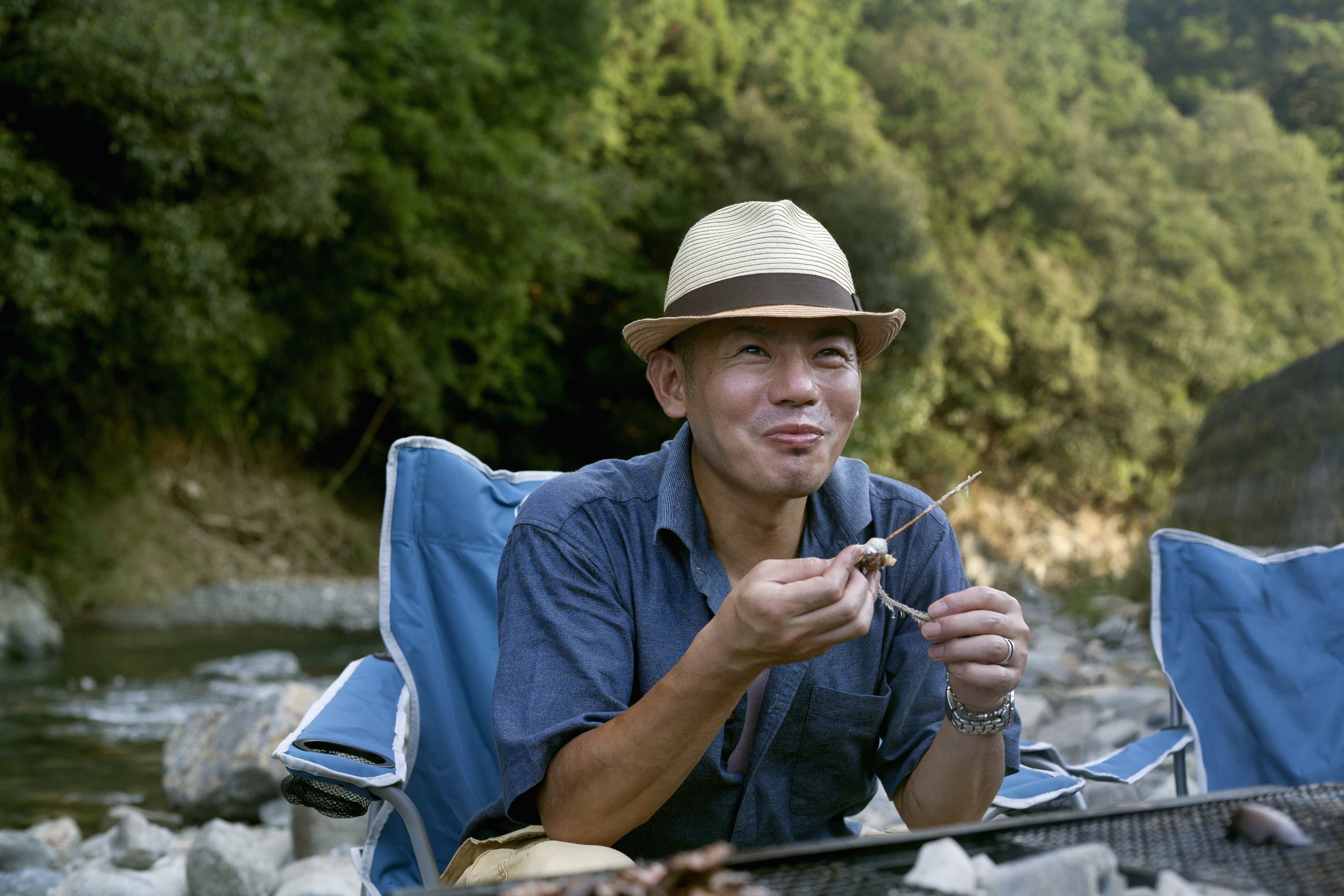Man eating by the river