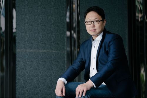 Man wearing a suit and glasses Man wearing a suit and glasses