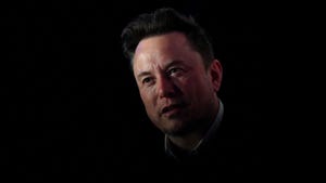 Elon Musk silhouetted on a black background. Musk's xAI startup will open sourcing its Grok AI model later this week.