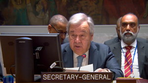 Image of Secretary-General António Guterres at a desk, speaking