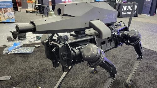 4 legged robot with a gun mounted on top 4 legged robot with a gun mounted on top