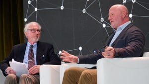 Informa editorial director Chuck Martin, left, talks to FedEx CTO Adam Smith, right, at the AI Summit New York. 