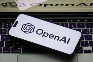 Smartphone displays OpenAI logo Smartphone displays OpenAI logo