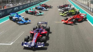 Racing cars of varying colors on a race track