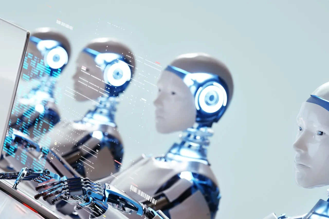 Robots working on laptops Robots working on laptops