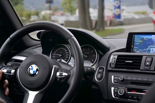 Photo inside a BMW car showing the dash and steering wheel 