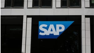 Blue and white SAP logo on the side of a black and light grey corporate building