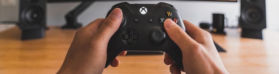 Person holding xbox controller