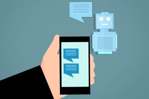A cartoon of a hand holding a phone which is displaying chat messages, with a robot in the background