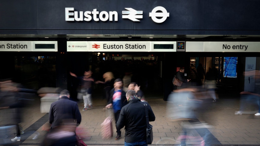 Passengers arrive and depart London Euston railway station