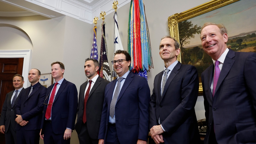 Seven tech executives standing in a room