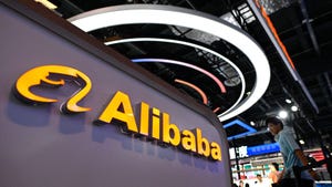 The logo of Alibaba on display at a conference