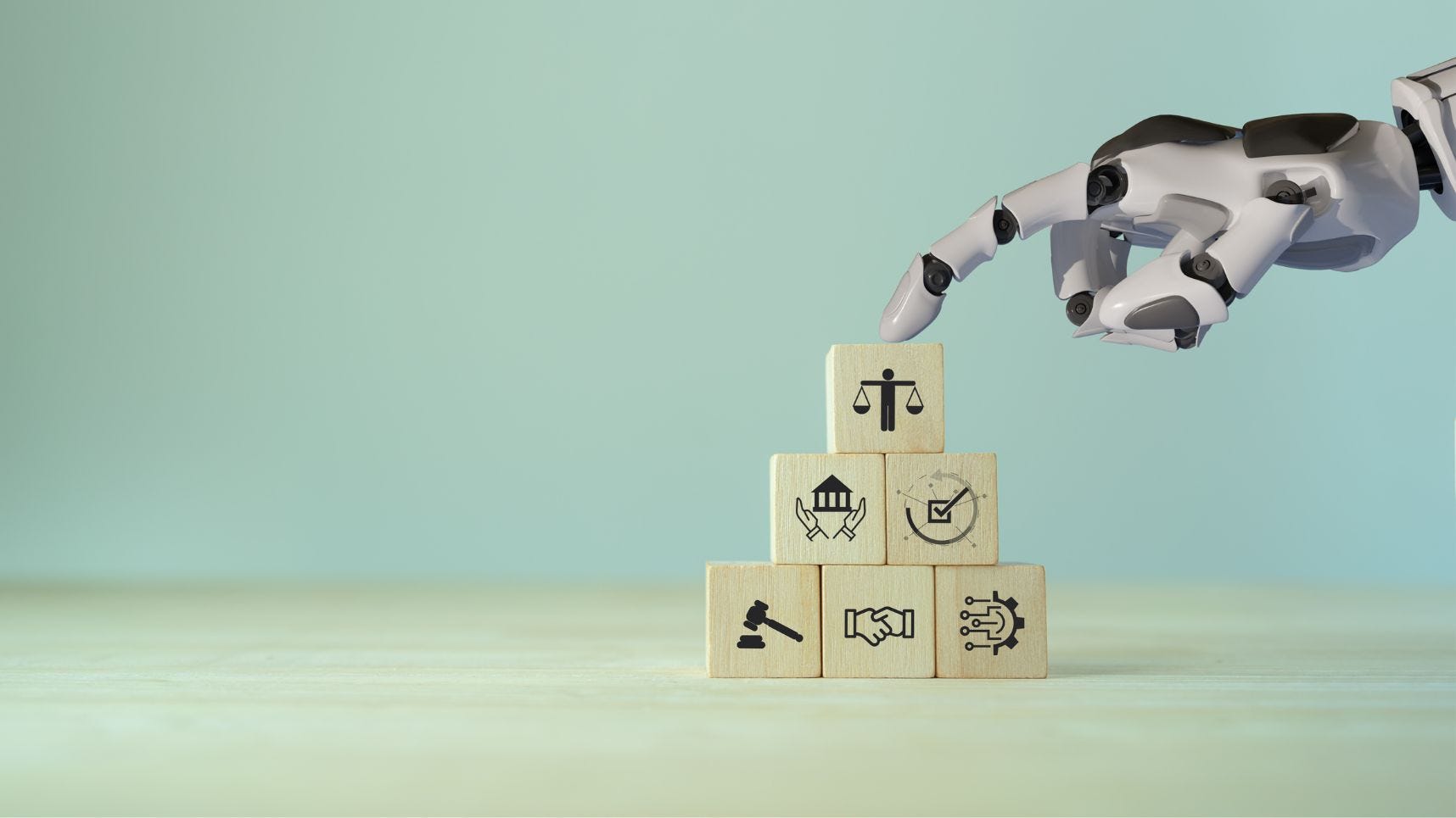A robot hand stacking blocks representing ethical considerations. When building policies on AI, it's important to consider legal compliance, employee needs, and business and customer needs.