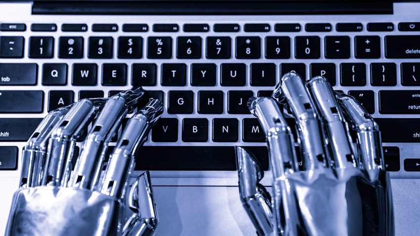 Robot hands typing on a keyboard