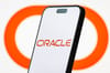 Photo of Oracle logo on smartphone Photo of Oracle logo on smartphone