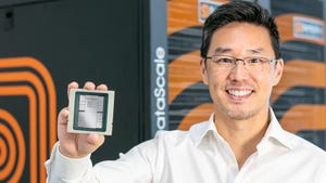 Photo of CEO Rodrigo Liang holding an AI chip