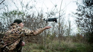 Ukrainian military assists operator in launching drone from hand in Zaporizhzhia, Ukraine.