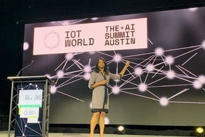 Presenter on stage at the AI summit